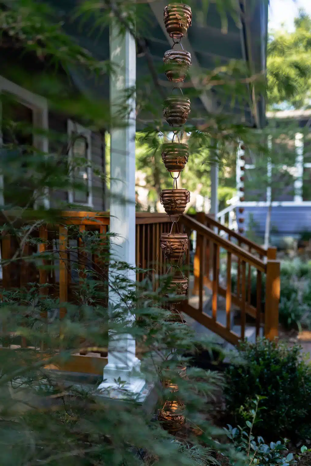 The Timekeeper Stay & Gardens rain chain and front porch